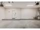 Clean three car garage with epoxy floors and white walls at 3591 S Ranger Trl, Gilbert, AZ 85297