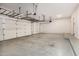 Spacious three car garage with epoxy floors and overhead storage at 3591 S Ranger Trl, Gilbert, AZ 85297