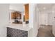 Open kitchen view featuring a breakfast bar with grey honeycomb tile and stainless steel appliances at 3591 S Ranger Trl, Gilbert, AZ 85297