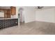 Open-concept living space with tiled floors, a sleek kitchen counter, and seamless flow into adjacent areas at 3591 S Ranger Trl, Gilbert, AZ 85297