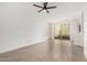 Expansive living area with tile flooring, patio access, neutral walls, and ample natural light at 3591 S Ranger Trl, Gilbert, AZ 85297