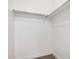 Walk-in closet featuring ample storage space and a metal clothing rod at 3591 S Ranger Trl, Gilbert, AZ 85297