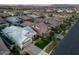 Expansive aerial view of a residential neighborhood with well-maintained homes and landscaped yards at 3918 E Arabian Dr, Gilbert, AZ 85296