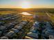 Sunrise view of a Primary-planned community with lake and walking trails at 3918 E Arabian Dr, Gilbert, AZ 85296
