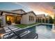 Landscaped backyard featuring a sparkling pool, lounge chairs, and manicured greenery at 3918 E Arabian Dr, Gilbert, AZ 85296