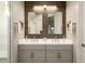 Bright bathroom featuring a double vanity, decorative mirrors and plenty of counter space at 3918 E Arabian Dr, Gilbert, AZ 85296