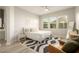 Well-lit bedroom with a queen-size bed, stylish rug, and large windows at 3918 E Arabian Dr, Gilbert, AZ 85296