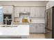 Bright kitchen with stainless steel appliances, white countertops, and ample cabinet space at 3918 E Arabian Dr, Gilbert, AZ 85296