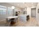 Well-lit kitchen featuring stainless steel appliances, a center island, and a dining area at 3918 E Arabian Dr, Gilbert, AZ 85296