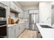 Modern kitchen featuring stainless steel appliances, subway tile backsplash, and quartz countertops at 3918 E Arabian Dr, Gilbert, AZ 85296