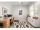 Bright home office featuring a large window, modern desk, and elegant decor at 3918 E Arabian Dr, Gilbert, AZ 85296