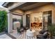 Inviting outdoor living area with stylish seating, a covered patio, and sliding doors at 3918 E Arabian Dr, Gilbert, AZ 85296