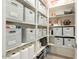 Organized pantry with shelves and storage bins, providing ample space for provisions at 3918 E Arabian Dr, Gilbert, AZ 85296