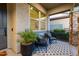 Inviting covered front porch with stylish seating, perfect for relaxing and enjoying the outdoors at 3918 E Arabian Dr, Gilbert, AZ 85296