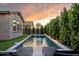 Sparkling pool with manicured landscaping, lounge chairs, and landscape lighting at 3918 E Arabian Dr, Gilbert, AZ 85296