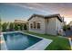 Sparkling pool with manicured landscaping, lounge chairs, and landscape lighting at 3918 E Arabian Dr, Gilbert, AZ 85296