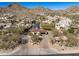 Stunning aerial view of a gated community nestled in the mountains with lush landscaping at 3980 E Sierra Vista Dr, Paradise Valley, AZ 85253
