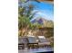 Relaxing backyard featuring comfortable seating, mountain views, and custom shade structure at 3980 E Sierra Vista Dr, Paradise Valley, AZ 85253