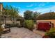 Inviting backyard with stone patio, water feature, and lush landscaping at 3980 E Sierra Vista Dr, Paradise Valley, AZ 85253