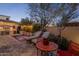 Inviting backyard with patio, lounge chairs, and a view of the pool and outdoor kitchen at 3980 E Sierra Vista Dr, Paradise Valley, AZ 85253