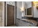Elegant bathroom features a marble countertop, custom cabinets, and decorative lighting at 3980 E Sierra Vista Dr, Paradise Valley, AZ 85253