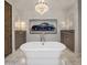 Luxurious bathroom featuring a freestanding tub, dual vanities, and elegant lighting at 3980 E Sierra Vista Dr, Paradise Valley, AZ 85253