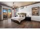 Inviting bedroom with private patio access and modern ceiling fan at 3980 E Sierra Vista Dr, Paradise Valley, AZ 85253