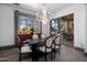Elegant dining room with hardwood floors, chandelier, and views to outside patio at 3980 E Sierra Vista Dr, Paradise Valley, AZ 85253