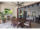 Open dining and living area with fireplace and TV, seamlessly blending indoor/outdoor living at 3980 E Sierra Vista Dr, Paradise Valley, AZ 85253
