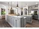 Gourmet kitchen featuring marble countertops, custom cabinetry, and high-end appliances at 3980 E Sierra Vista Dr, Paradise Valley, AZ 85253
