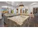Gourmet kitchen with center island and views to living room and backyard at 3980 E Sierra Vista Dr, Paradise Valley, AZ 85253