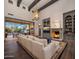 Inviting living room features fireplace, custom built-ins, and large sliding doors to the backyard at 3980 E Sierra Vista Dr, Paradise Valley, AZ 85253