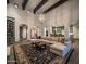 Expansive living area with vaulted ceilings, exposed beams, a custom rug, and access to other rooms at 3980 E Sierra Vista Dr, Paradise Valley, AZ 85253