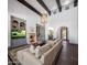 Spacious living room showcasing high ceilings, fireplace, custom built-ins, and hardwood floors at 3980 E Sierra Vista Dr, Paradise Valley, AZ 85253