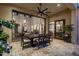 Covered patio with a dining table, chandelier, and access to the living room and kitchen at 3980 E Sierra Vista Dr, Paradise Valley, AZ 85253