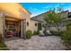 Charming outdoor patio with stone flooring, open doorway to office, and lush lemon tree at 3980 E Sierra Vista Dr, Paradise Valley, AZ 85253