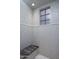 Modern shower featuring custom tile work, built-in seat, and window at 3980 E Sierra Vista Dr, Paradise Valley, AZ 85253