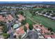 A high-angle captures a residential area with neat red-tiled roofs and lush fairways from an adjacent golf course at 4020 E Laurel Ln, Phoenix, AZ 85028