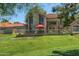 Inviting backyard with lush green grass, privacy fence, and outdoor seating area at 4020 E Laurel Ln, Phoenix, AZ 85028