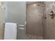 Modern tiled shower with glass door and chrome fixtures at 4020 E Laurel Ln, Phoenix, AZ 85028