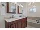 Elegant bathroom with double vanity, soaking tub, and modern fixtures at 4020 E Laurel Ln, Phoenix, AZ 85028