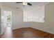 Bedroom with wood floors and view of a chandelier and pool at 4020 E Laurel Ln, Phoenix, AZ 85028