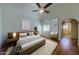 Calming bedroom features a vaulted ceiling, en-suite bath, and large window at 4020 E Laurel Ln, Phoenix, AZ 85028