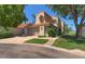 Charming two-story home featuring a well-manicured lawn and attached two-car garage at 4020 E Laurel Ln, Phoenix, AZ 85028