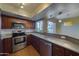 Modern kitchen with stainless steel appliances and granite countertops at 4020 E Laurel Ln, Phoenix, AZ 85028