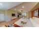 Open-concept living space with hardwood floors, ceiling fan, and view of kitchen at 4020 E Laurel Ln, Phoenix, AZ 85028