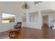 Spacious living room features plenty of natural light, a leather chair and hardwood flooring at 4020 E Laurel Ln, Phoenix, AZ 85028