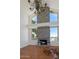 Bright living room features a grand fireplace, high ceilings, and a statement chandelier at 4020 E Laurel Ln, Phoenix, AZ 85028