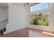 Inviting living room featuring hardwood floors and a large window with views of the exterior plants at 4020 E Laurel Ln, Phoenix, AZ 85028