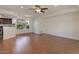 Bright living room with wood floors, ceiling fan, and natural light at 4020 E Laurel Ln, Phoenix, AZ 85028